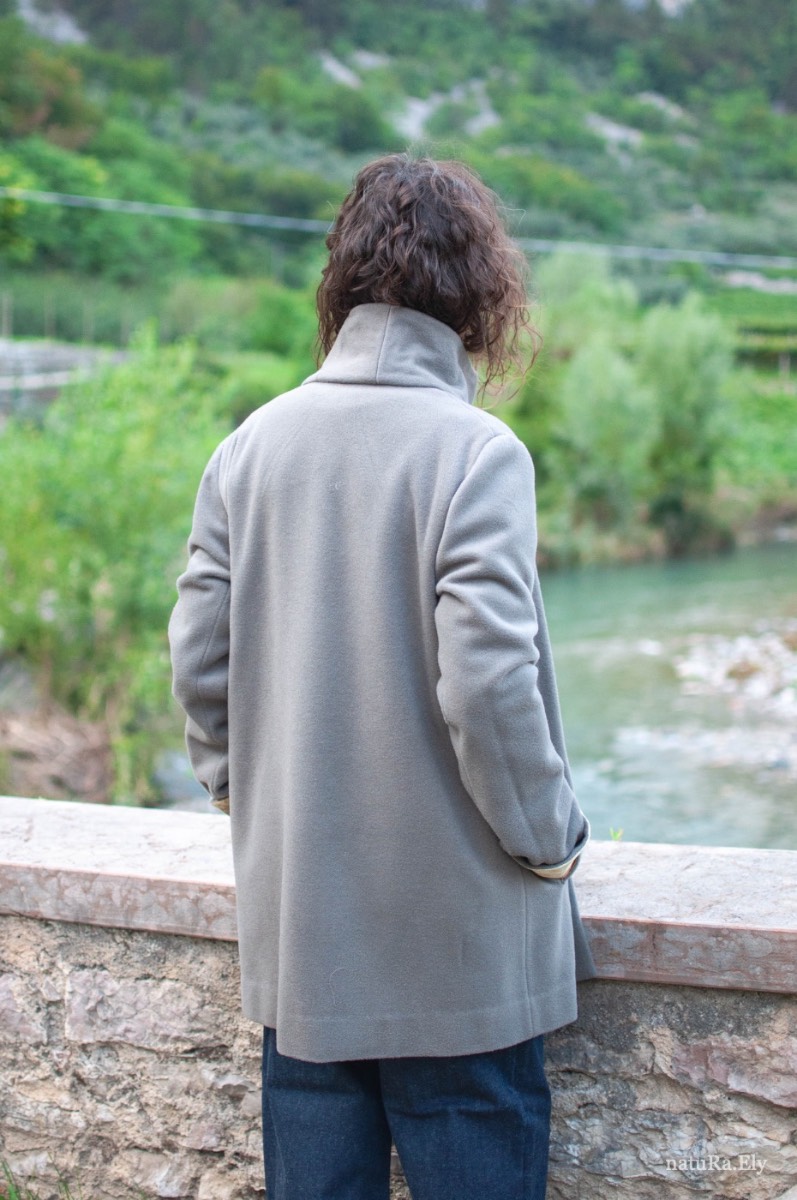 Along the Sarca — Pelèr N° I, grey wool, cashmere and alpaca coat with standing collar, handmade in the natuRa.Ely atelier in Arco, Lake Garda